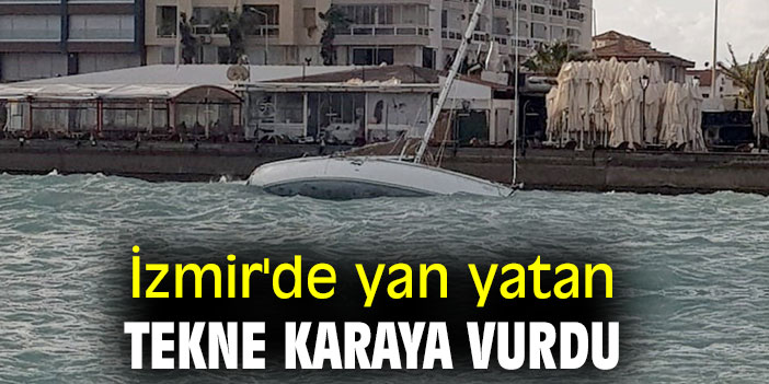 İzmir'de yan yatan tekne karaya vurdu