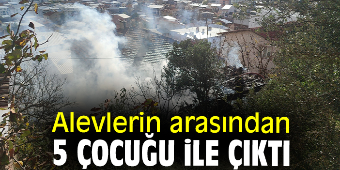 Alevlerin arasından 5 çocuğu ile çıktı