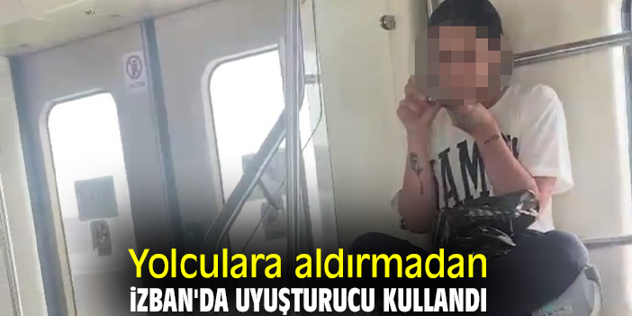 Yolculara aldırmadan İZBAN'da uyuşturucu kullandı