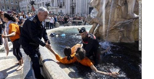 230507103156-italy-climate-protest-fountain-black-restricted-large-tease.jpeg